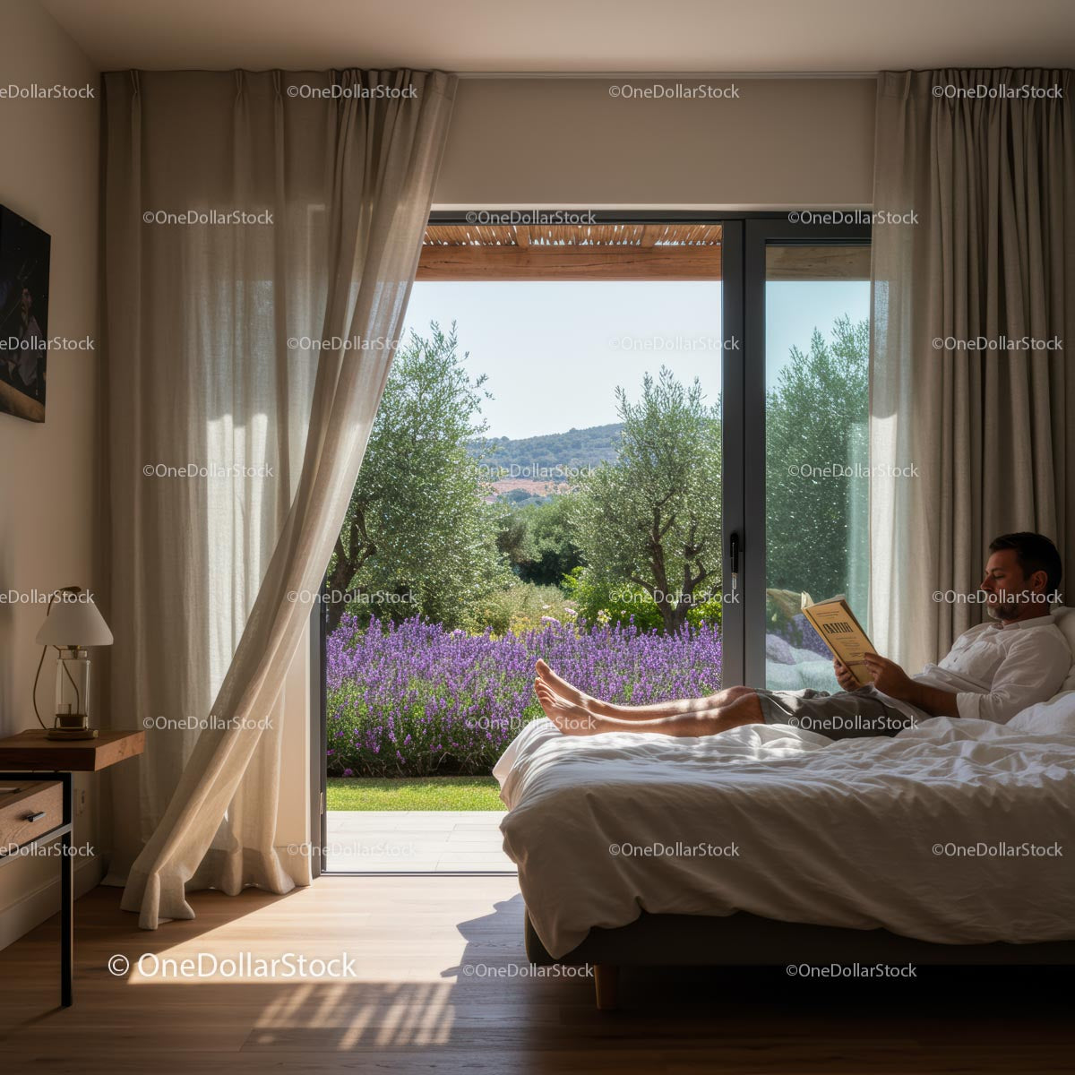 Man Relaxing with Book Overlooking Lavender Garden