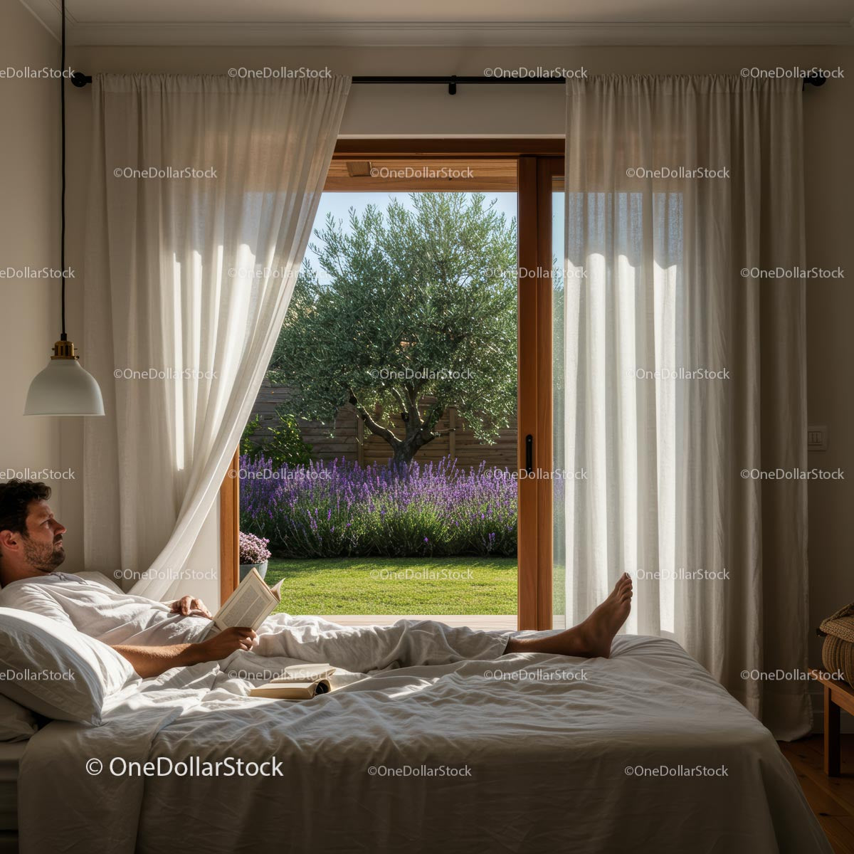 Man Relaxing in Bed with Lavender Garden View