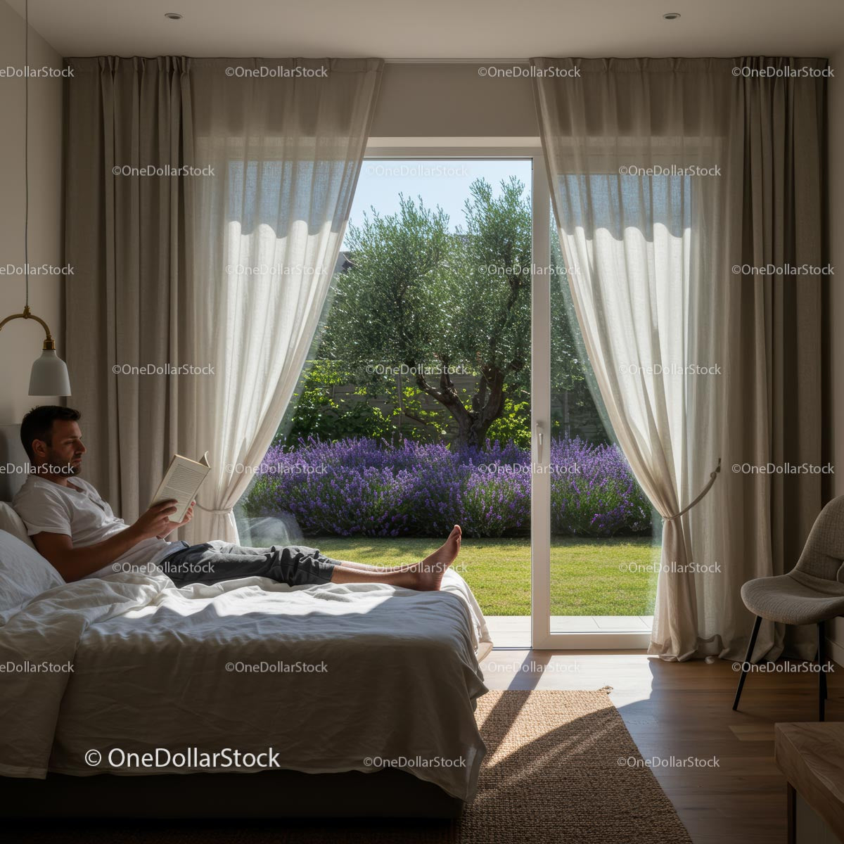 Man Reading in Cozy Bedroom With Lavender Garden View