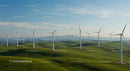 Wind Turbines on Rolling Green Hills Under Blue Sky
