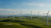 Wind Turbines on Rolling Green Hills Under Blue Sky
