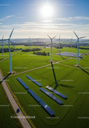Scenic Green Landscape with Wind Turbines and Solar Panels