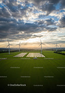 Wind Turbines and Solar Panels at Sunset in Green Field