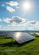 Solar Panels in a Sunny Field with Blue Sky
