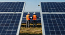 Engineers Inspecting Solar Panels at Sustainable Energy Site