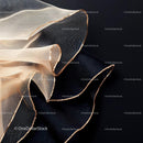 Elegant Black and Beige Fabric with Golden Trim