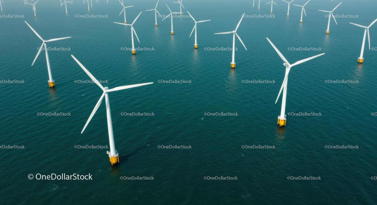 Aerial View of Offshore Wind Turbines in Blue Ocean