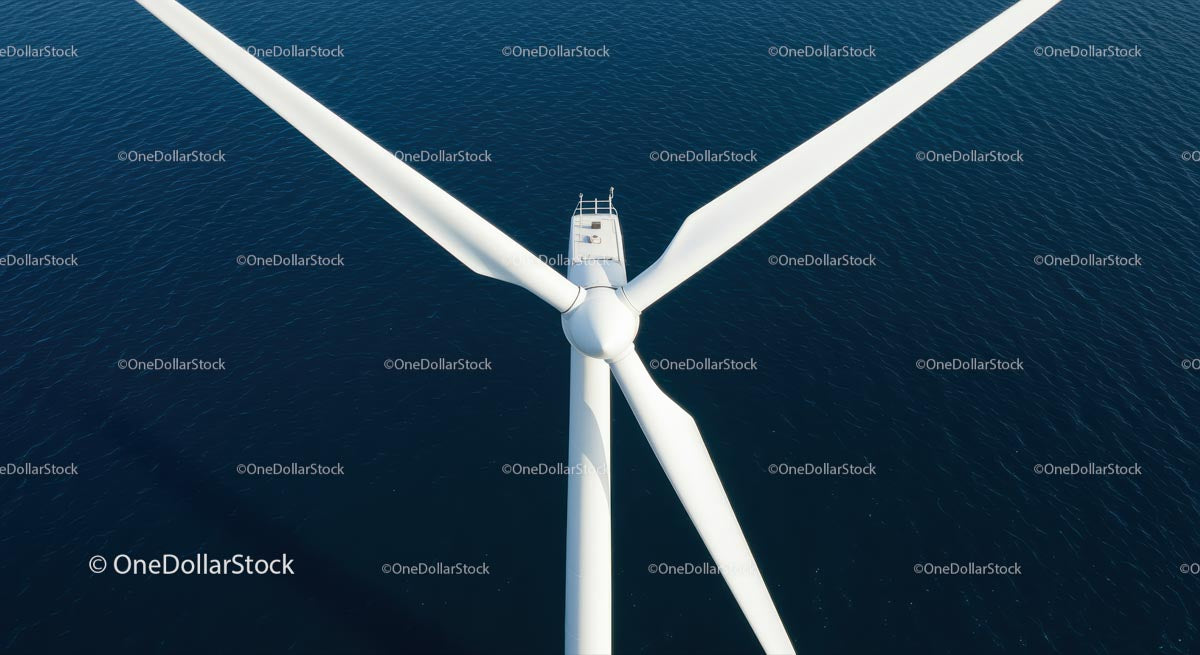 Aerial View of Offshore Wind Turbine Over Blue Ocean Waters
