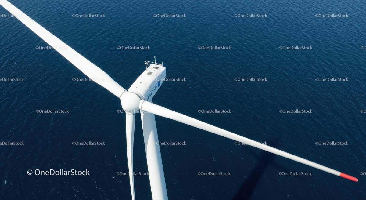 Aerial View of Offshore Wind Turbine Over Blue Ocean