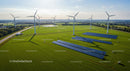 Aerial View of Wind Turbines and Solar Panels in Green Field