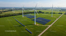 Wind Turbines and Solar Panels on Green Field Landscape