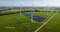Wind Turbines and Solar Panels on Green Field Landscape