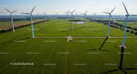 Aerial View of Wind Turbines on Green Field