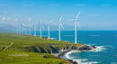 Wind Turbines Overlooking Green Coastline and Blue Ocean