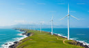 Wind Turbines on Scenic Coastal Cliff Overlooking Ocean