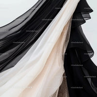 Elegant Draping of Contrasting Black and White Fabrics