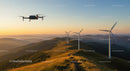 Drone Over Mountainous Wind Farm at Golden Sunset