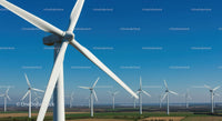 Panoramic View of Wind Turbines Under Clear Blue Sky