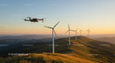 Drone Over Wind Turbines at Sunset in Scenic Hills