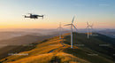 Drone Over Wind Turbines at Sunset in Mountainous Landscape