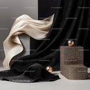 Elegant Beige and Black Textured Fabric with Decorative Spheres