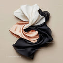 Elegant Swirl of Black, White, and Beige Silk Fabric