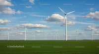 Wind Turbines on Green Field Under Blue Sky