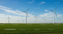 Wind Turbines in Green Field Under Blue Sky