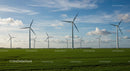 Wind Turbines on Lush Green Fields Under Blue Skies
