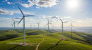 Wind Turbines on Lush Green Hills Under Blue Skies