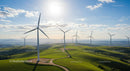 Wind Turbines on Lush Green Hills Under Clear Sky