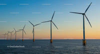 Offshore Wind Turbines at Sunset Over the Ocean