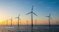 Offshore Wind Turbines at Sunset Over Tranquil Sea