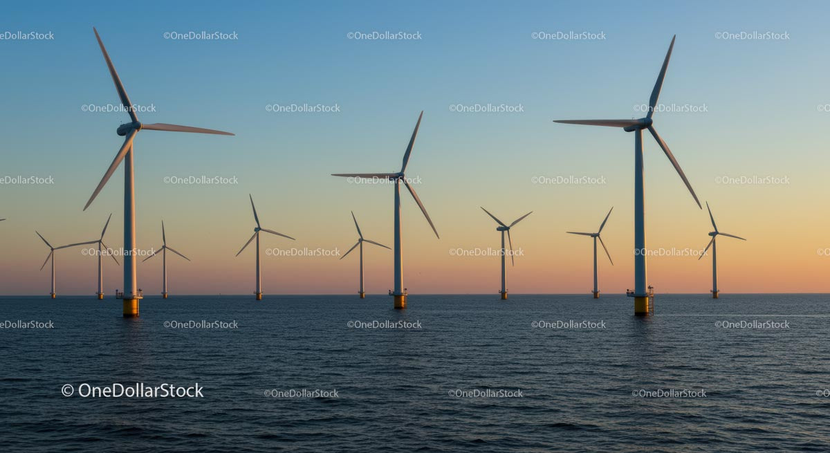 Offshore Wind Turbines at Sunset on Calm Ocean Waters