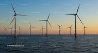 Offshore Wind Turbines at Sunset on Calm Ocean Waters