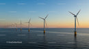 Offshore Wind Turbines at Sunset Over Calm Ocean