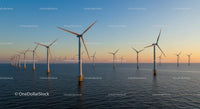 Offshore Wind Farm at Sunset Over Expansive Ocean