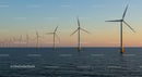 Offshore Wind Turbines at Sunset Over Calm Sea