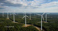 Wind Turbines in Lush Green Forest Under Blue Sky