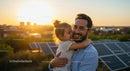 Father and Daughter Embrace at Sunset Near Solar Panels