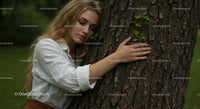 Woman Embracing Tree in Serene Natural Setting
