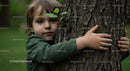 Child Embracing Nature with a Tree Hug in the Forest