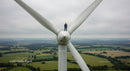 Engineer Maintaining Wind Turbine on Rural Wind Farm