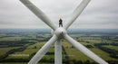 Technician Performing Maintenance on Wind Turbine