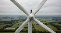 Technician Performing Maintenance on Wind Turbine