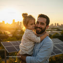Father and Daughter Embracing at Sunset Near Solar Panels