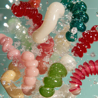Vibrant Spiral Candies in a Splash of Motion