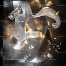 Futuristic Abstract Sculpture with Metallic Swirls and Glass