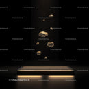 Floating Golden Rocks on Illuminated Platform in Dark Ambience
