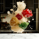 Colorful Peppers Splashing with Ice in Kitchen Setting